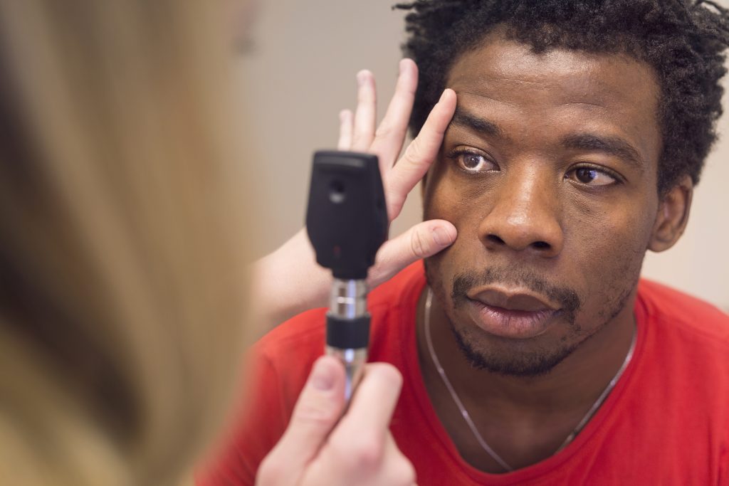 Doctor Examining Young Mans Eye RBPXR6F 1024X683